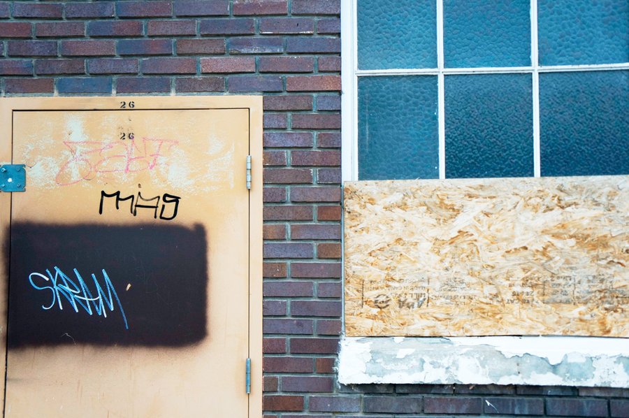 Graffiti door and boarded window