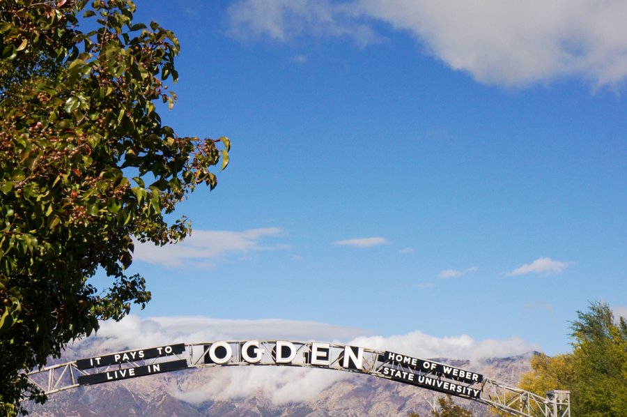 Ogden sign with mountains — Home of Weber State University